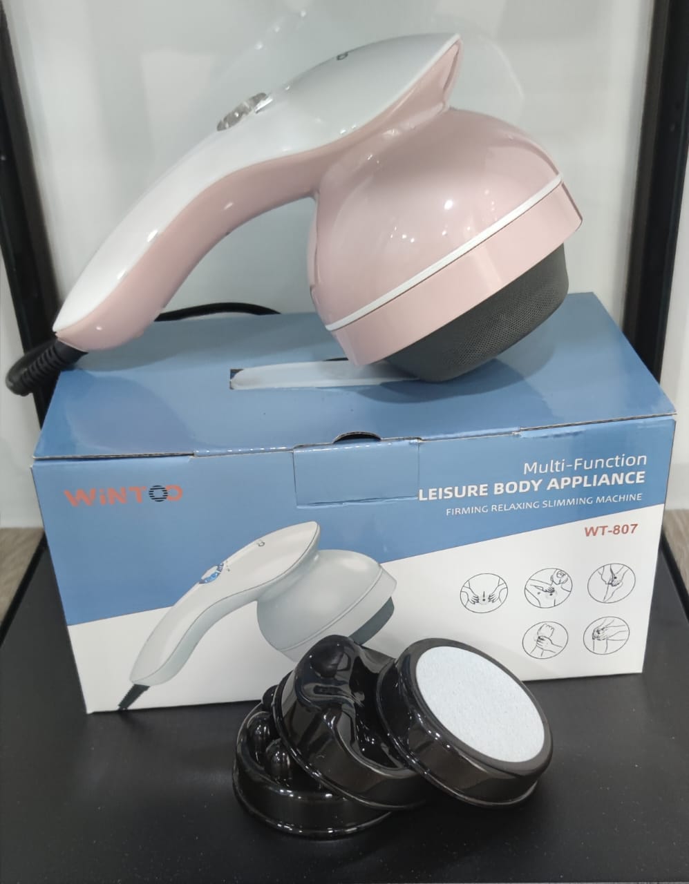 Wintoo WT-807 baby pink handheld body massager with red heat wave lighting therapy for slimming and muscle pain relief