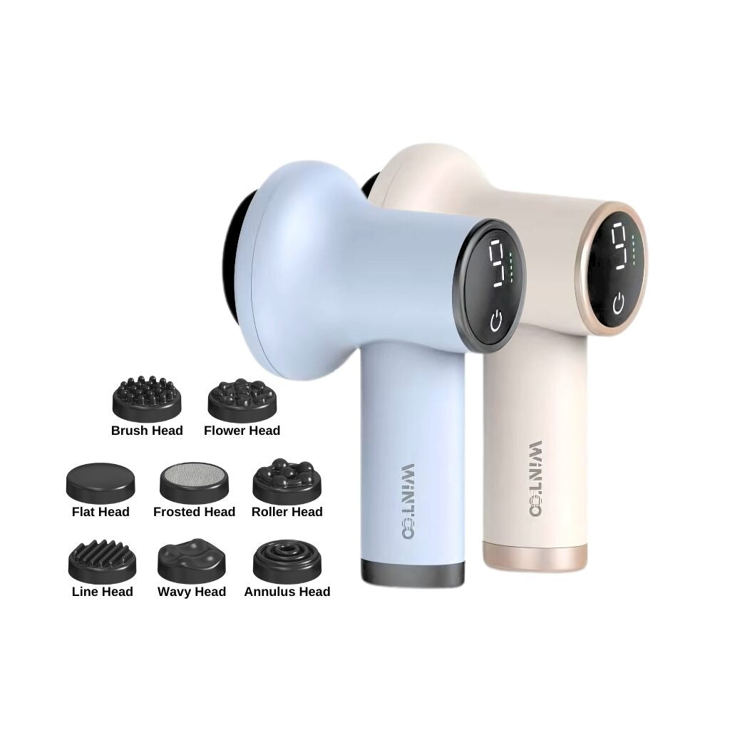 TrexMax Mini Massagers in pastel blue and beige colors with digital display screens on the back. Below them are eight labeled interchangeable massage heads: Brush Head, Flower Head, Flat Head, Frosted Head, Roller Head, Line Head, Wavy Head, and Annulus Head.